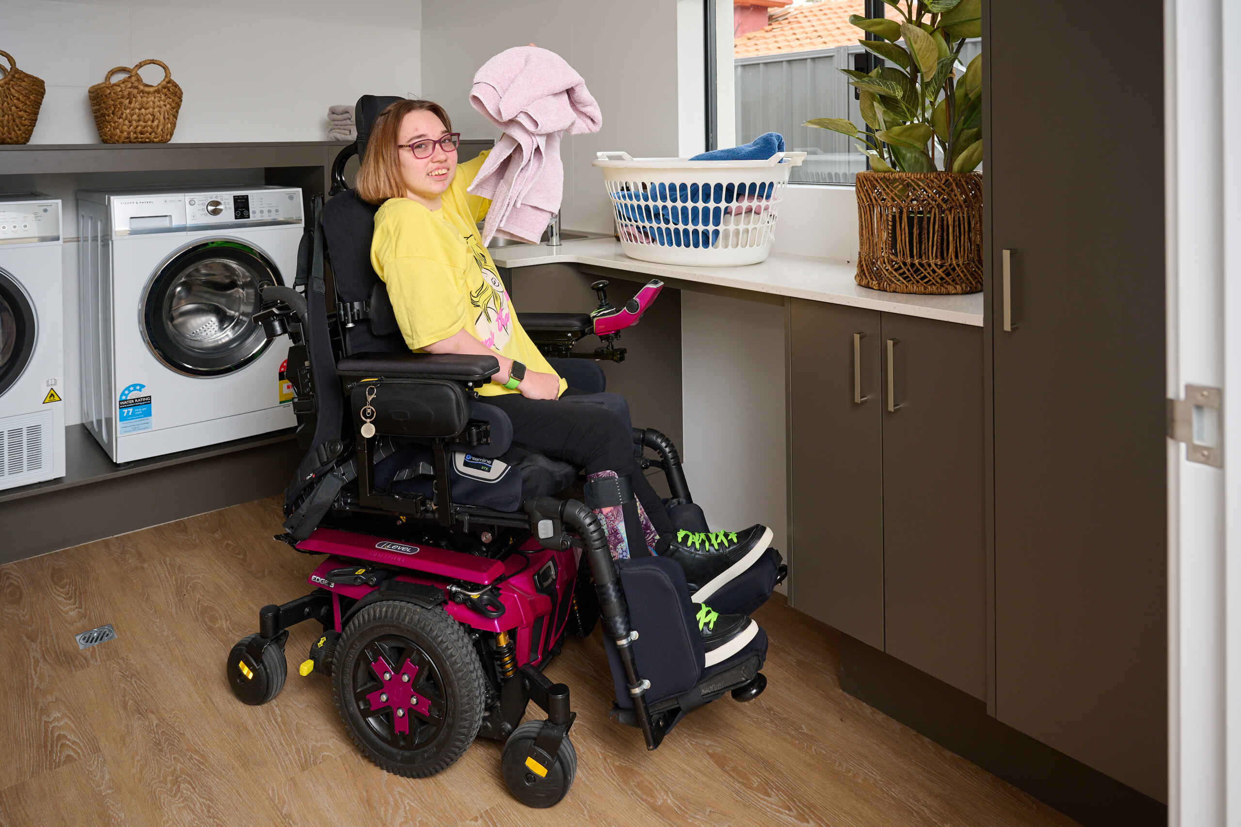 a disability user friendly home with someone doing their laundry