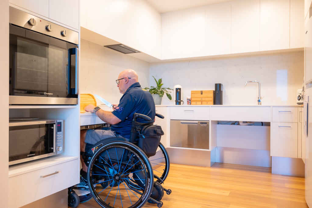 disabled friendly user house with someone in their kitchen.